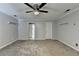 Large bedroom with ceiling fan and neutral colored walls at 5025 Oak Bluff Ct, Atlanta, GA 30350