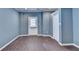A charming bedroom featuring stylish blue walls and wood floors, adding sophistication and visual appeal at 5025 Oak Bluff Ct, Atlanta, GA 30350