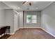 Bedroom with hardwood floors, a desk, and a bright window, offers a versatile space for work or relaxation at 5025 Oak Bluff Ct, Atlanta, GA 30350