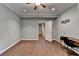 Bedroom with hardwood floors and a desk offers a versatile space for work or relaxation at 5025 Oak Bluff Ct, Atlanta, GA 30350