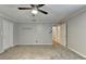 Open bedroom area showing neutral walls, fan, and attached bathroom entrance at 5025 Oak Bluff Ct, Atlanta, GA 30350