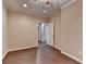 A light-filled bedroom with hardwood floors and neutral paint, providing a welcoming and adaptable space at 5025 Oak Bluff Ct, Atlanta, GA 30350