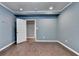 Bright bedroom with hardwood floors and light blue walls, offering a clean and modern space at 5025 Oak Bluff Ct, Atlanta, GA 30350