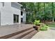 A large, wooden deck on the rear of the house features flower boxes at 5025 Oak Bluff Ct, Atlanta, GA 30350