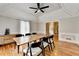 Bright dining room featuring decorative ceilings, wood floors, and stylish furnishings at 5025 Oak Bluff Ct, Atlanta, GA 30350