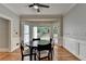 Elegant dining room with wood floors and backyard views at 5025 Oak Bluff Ct, Atlanta, GA 30350