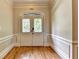 Welcoming foyer featuring hardwood floors and decorative double doors at 5025 Oak Bluff Ct, Atlanta, GA 30350