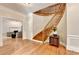 Elegant foyer with hardwood floors and a curved staircase at 5025 Oak Bluff Ct, Atlanta, GA 30350