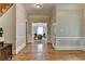 Hallway featuring beautiful wood floors and elegant molding at 5025 Oak Bluff Ct, Atlanta, GA 30350