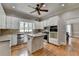 Gourmet kitchen featuring an island, granite countertops and stainless steel appliances at 5025 Oak Bluff Ct, Atlanta, GA 30350