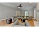 Spacious living room featuring hardwood floors, recessed lighting, and neutral paint at 5025 Oak Bluff Ct, Atlanta, GA 30350