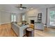Bright living room boasts a marble fireplace, recessed lighting, and hardwood floors at 5025 Oak Bluff Ct, Atlanta, GA 30350