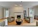 Bright living room with a marble fireplace and stylish contemporary furnishings at 5025 Oak Bluff Ct, Atlanta, GA 30350