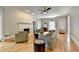 Spacious living room with hardwood floors, a fireplace, and ample natural light at 5025 Oak Bluff Ct, Atlanta, GA 30350