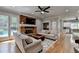 Inviting living room with brick fireplace, flat screen, and views to the pool at 5025 Oak Bluff Ct, Atlanta, GA 30350
