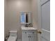 Cozy powder room features a white vanity and fixtures at 5025 Oak Bluff Ct, Atlanta, GA 30350
