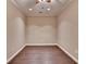 Empty room boasts beautiful hardwood floors, perfect for creating a personalized space for any need at 5025 Oak Bluff Ct, Atlanta, GA 30350