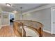 Beautiful staircase with hardwood floors and a curved railing at 5025 Oak Bluff Ct, Atlanta, GA 30350