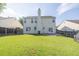Large backyard with grass and back of house view at 789 Clairidge Elm Sw Trl, Lawrenceville, GA 30046
