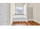 This is a full bathroom with a bathtub and a shower with wood flooring at 789 Clairidge Elm Sw Trl, Lawrenceville, GA 30046