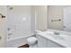Bathroom with white cabinets, sink, toilet and shower/tub combo at 789 Clairidge Elm Sw Trl, Lawrenceville, GA 30046