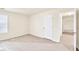 Bright bedroom with neutral walls and carpet features a ceiling fan and good light at 789 Clairidge Elm Sw Trl, Lawrenceville, GA 30046