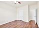 Comfortable bedroom with hardwood floors, neutral paint, offering a blank canvas for personal touches at 789 Clairidge Elm Sw Trl, Lawrenceville, GA 30046