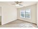 Bedroom featuring a ceiling fan, good light and neutral walls and carpet at 789 Clairidge Elm Sw Trl, Lawrenceville, GA 30046
