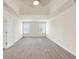 Spacious bedroom features plush carpeting, and natural light from two windows at 789 Clairidge Elm Sw Trl, Lawrenceville, GA 30046