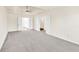 Large bedroom with carpeted floors, featuring a trey ceiling and double doors at 789 Clairidge Elm Sw Trl, Lawrenceville, GA 30046