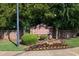 The Clairidge Crossing community sign is set amid vibrant greenery and manicured flowerbeds at 789 Clairidge Elm Sw Trl, Lawrenceville, GA 30046
