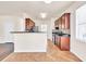 Well-lit kitchen with granite countertops, stainless steel appliances, and seamless access to dining area at 789 Clairidge Elm Sw Trl, Lawrenceville, GA 30046