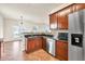 Spacious kitchen with stainless steel appliances and ample cabinet space that leads to a cozy breakfast nook at 789 Clairidge Elm Sw Trl, Lawrenceville, GA 30046