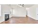Bright living room featuring a fireplace, hardwood floors, and ample natural light at 789 Clairidge Elm Sw Trl, Lawrenceville, GA 30046