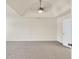 Large bedroom with tray ceiling, ceiling fan, and neutral carpet, offering a serene retreat at 789 Clairidge Elm Sw Trl, Lawrenceville, GA 30046