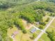 Beautiful aerial view of a home with a large lawn and a wooded area behind the house at 140 Maranatha Trl, Lawrenceville, GA 30045