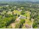 Expansive aerial view of the property showcasing a modern home, lush greenery, and neighborhood charm at 140 Maranatha Trl, Lawrenceville, GA 30045