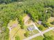 Stunning aerial view shows cleared lot next to traditional home with manicured lawn and wooded area at 140 Maranatha Trl, Lawrenceville, GA 30045