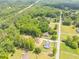 Beautiful aerial view of a home and adjacent cleared lot surrounded by lush green trees at 140 Maranatha Trl, Lawrenceville, GA 30045