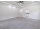Expansive bedroom with plush carpets, all white walls, and ceiling fan at 140 Maranatha Trl, Lawrenceville, GA 30045