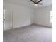 Bedroom with neutral carpet, ceiling fan, trim, and bright natural light at 140 Maranatha Trl, Lawrenceville, GA 30045