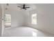 Bedroom features luxury tile floors, tall ceilings and a ceiling fan at 140 Maranatha Trl, Lawrenceville, GA 30045