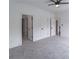 Bright bedroom with neutral carpet, multiple doors, ceiling fan, and white trim at 140 Maranatha Trl, Lawrenceville, GA 30045