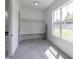 Walk-in closet with built in shelving and clothing rods, accompanied by an elegant standing mirror at 140 Maranatha Trl, Lawrenceville, GA 30045