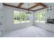 Bright dining room features beamed ceilings, large windows, and marble floors at 140 Maranatha Trl, Lawrenceville, GA 30045