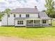 Beautifully constructed modern farmhouse style home featuring a well-manicured lawn and inviting front porch at 140 Maranatha Trl, Lawrenceville, GA 30045
