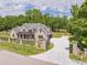 Stunning brick home with meticulously maintained lawn, black iron fence, and patterned concrete driveway at 140 Maranatha Trl, Lawrenceville, GA 30045