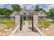 Stunning brick and stone home with manicured landscaping and black iron fencing creates a welcoming curb appeal at 140 Maranatha Trl, Lawrenceville, GA 30045