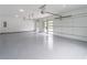 Modern garage with an epoxy floor and glass doors allowing plenty of natural light and easy access at 140 Maranatha Trl, Lawrenceville, GA 30045