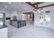 Beautiful kitchen with a center island, modern lighting, and sleek black countertops at 140 Maranatha Trl, Lawrenceville, GA 30045